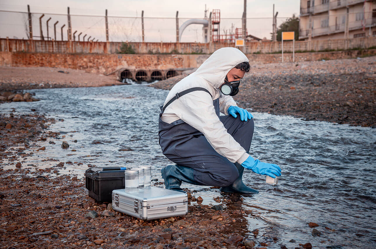 Scientist wearing protective uniform and glove und