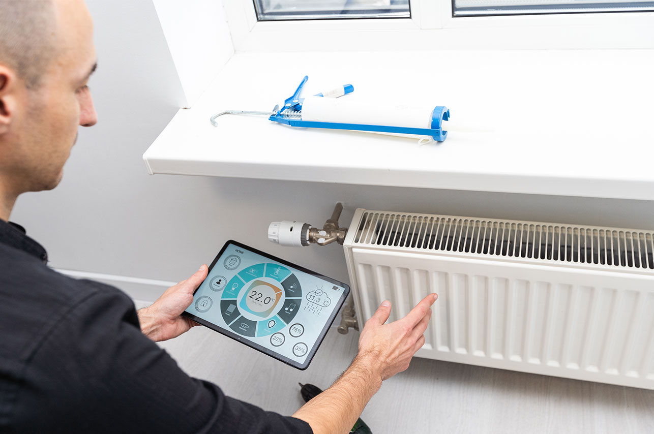 The technician checking the heating system in the